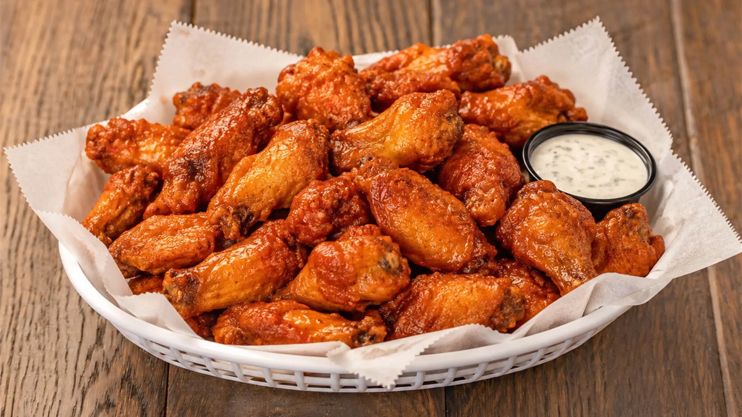 A big basket of saucy premium wings